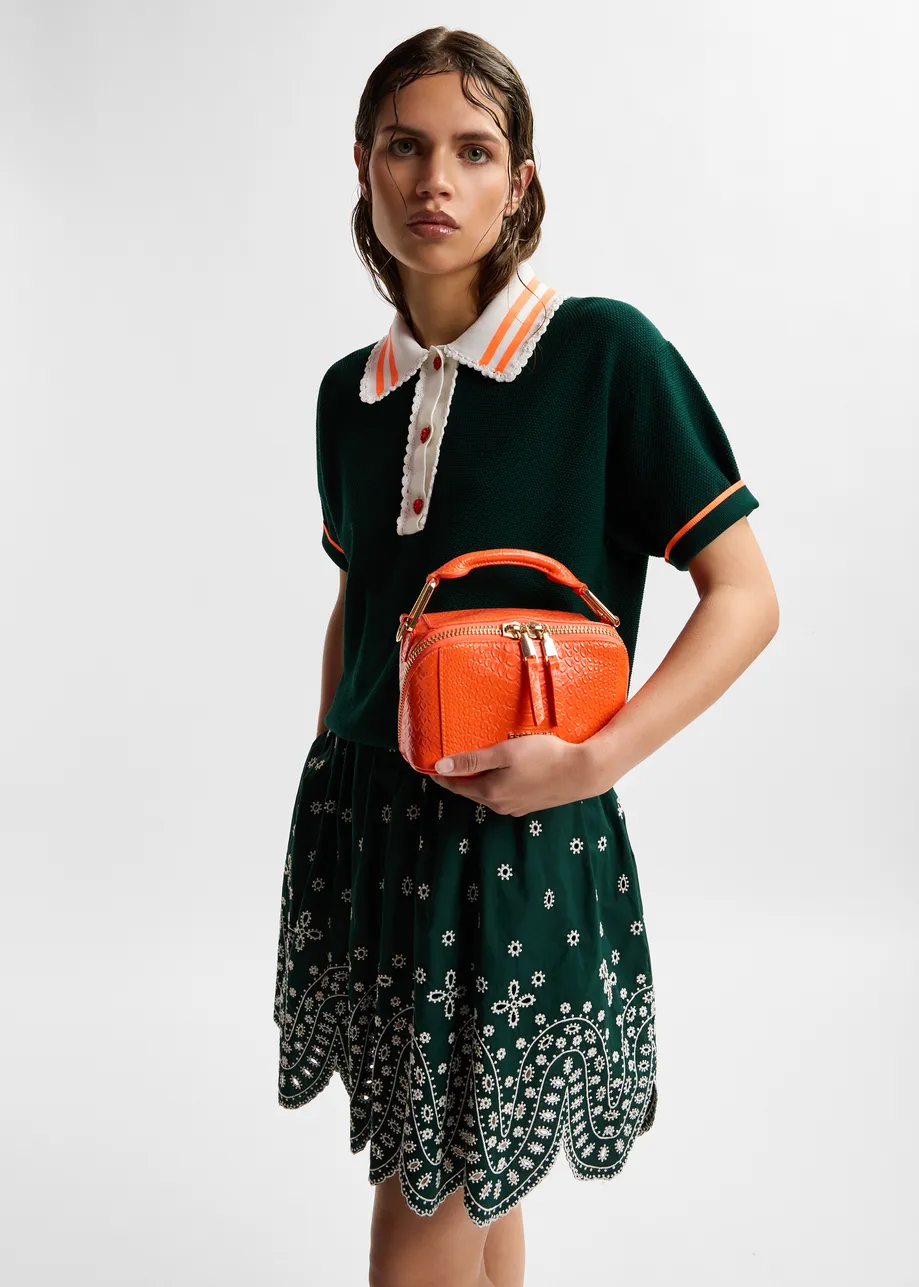 Dark green fine knit polo top with white and orange lace-trimmed collar and strawberry-shaped buttons