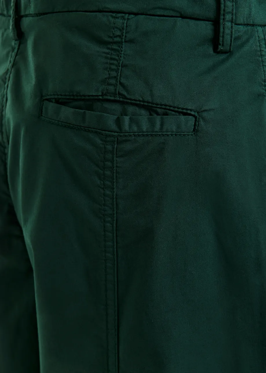 Khaki tapered cotton pants with twisted seams
